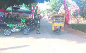 Pemasangan Umbul-Umbul Sambut Upacara Penutupan TMMD