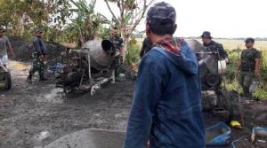 Guyuran Air Hujan Iringi Pembangunan Jalan TMMD